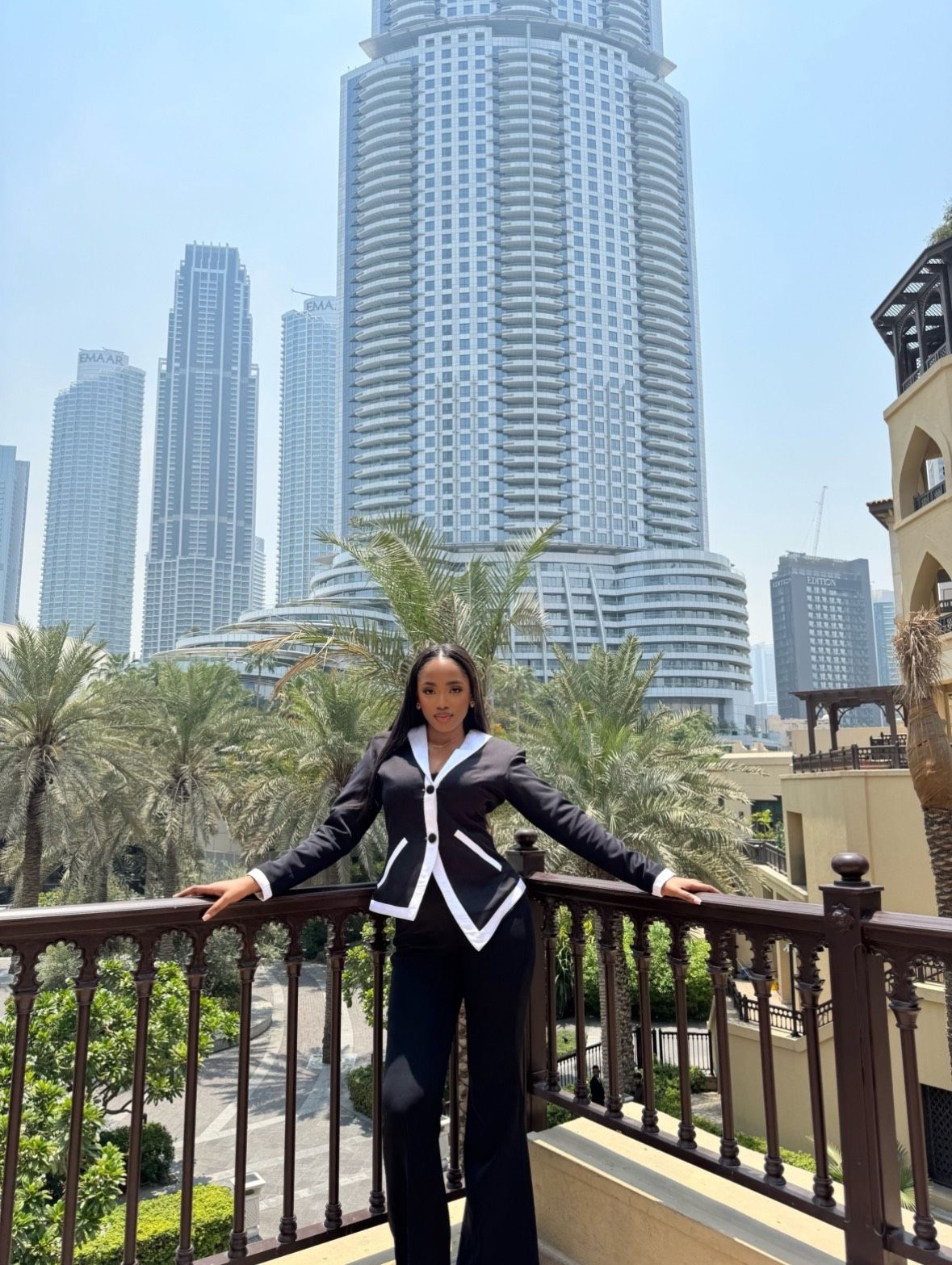 Chinwe on a balcony overlooking the Dubai skyline